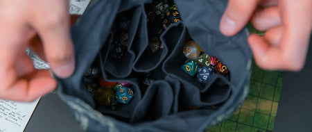 The DM Bag vs the Player Pouch: Two Different Jobs, Two Different Dice Bags