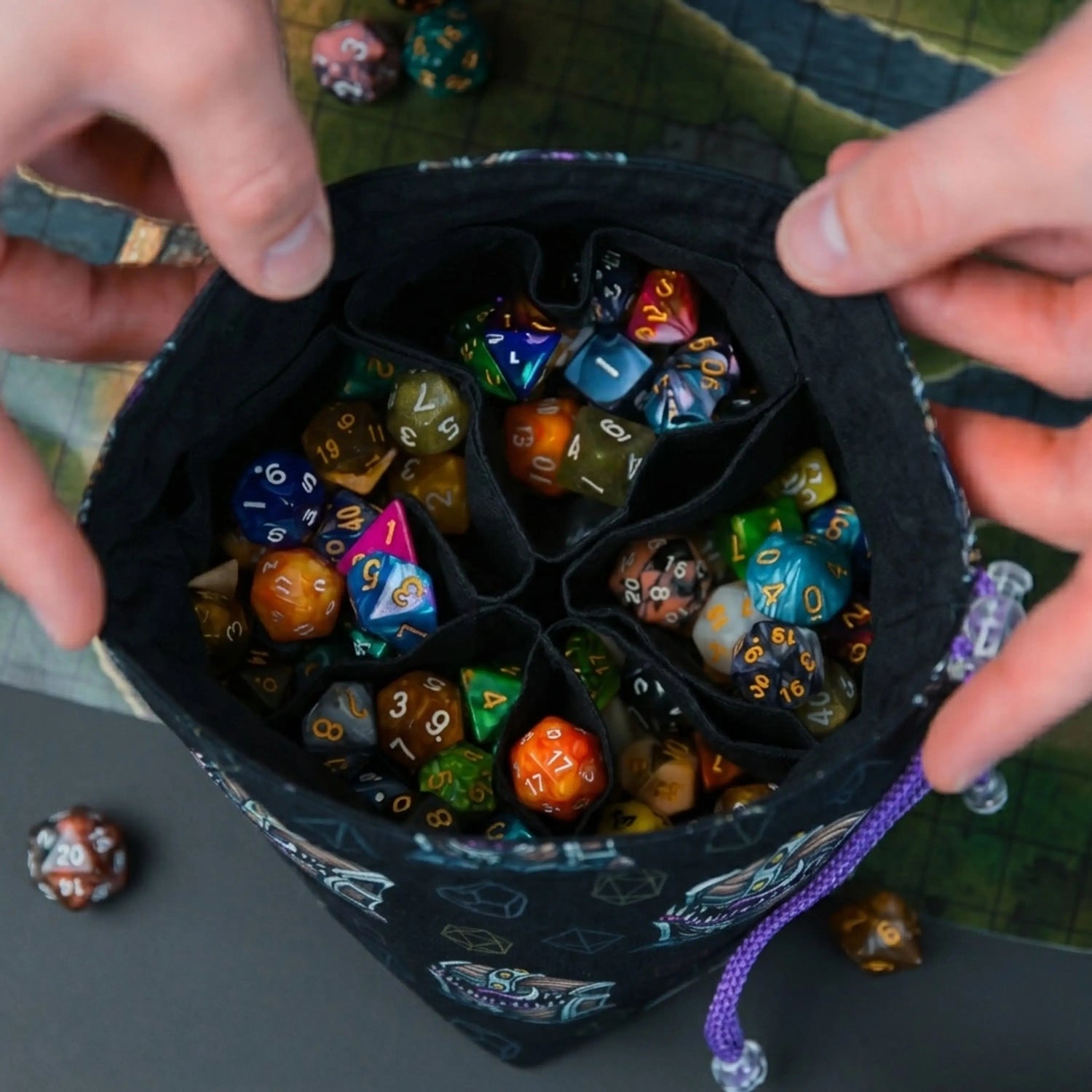 Handmade 6-pocket dice bag holding multiple sorted dice sets — DM organization system, sewn in our Cherkasy, Ukraine studio.