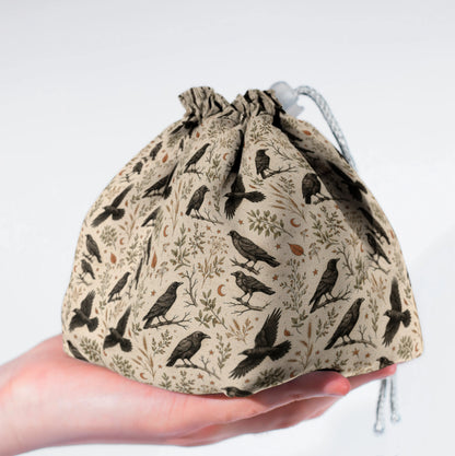 Handmade crow dice bag — a flock of black crows and stars on cream, a 6-pocket dark academia organizer.
