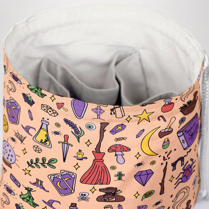 Witchy doodle dice bag with 6 pockets — sorts dice sets for a witchy table.