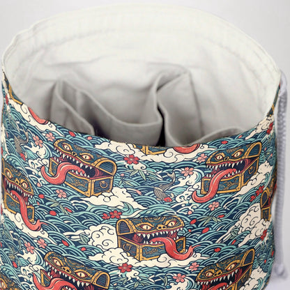 Ukiyo-e mimic dice bag print detail — gold-trimmed chests with red tongues between waves