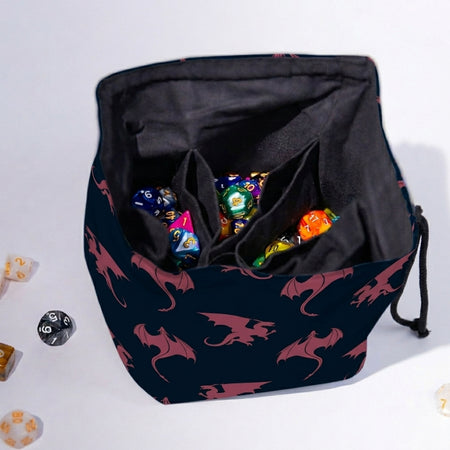 Handmade navy dragon dice bag open to show pockets and dice — rose dragon silhouettes, 300+ capacity.