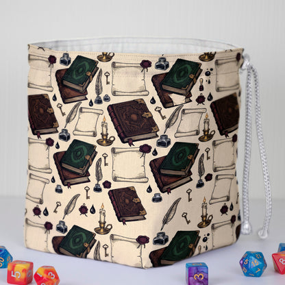 Antique spellbook print dice bag with 6 pockets — sorts dice sets for a Dungeon Master.