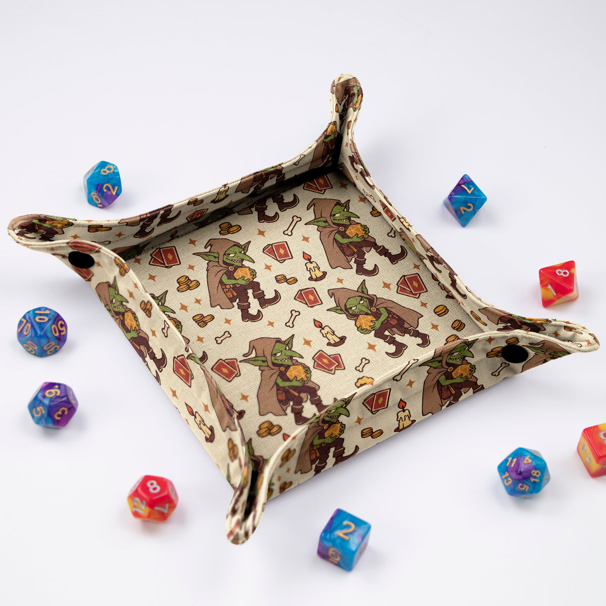 GameFancy Tavern Goblin foldable dice tray at an angle, black snap buttons at the corners, cream goblin tavern print