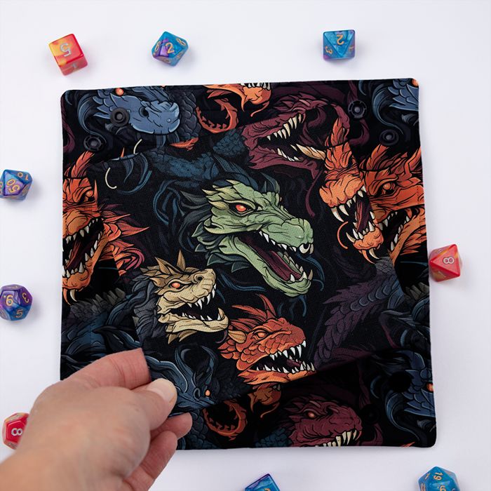 Chromatic Dragon dice tray folded flat with the removable hard insert lifted by hand