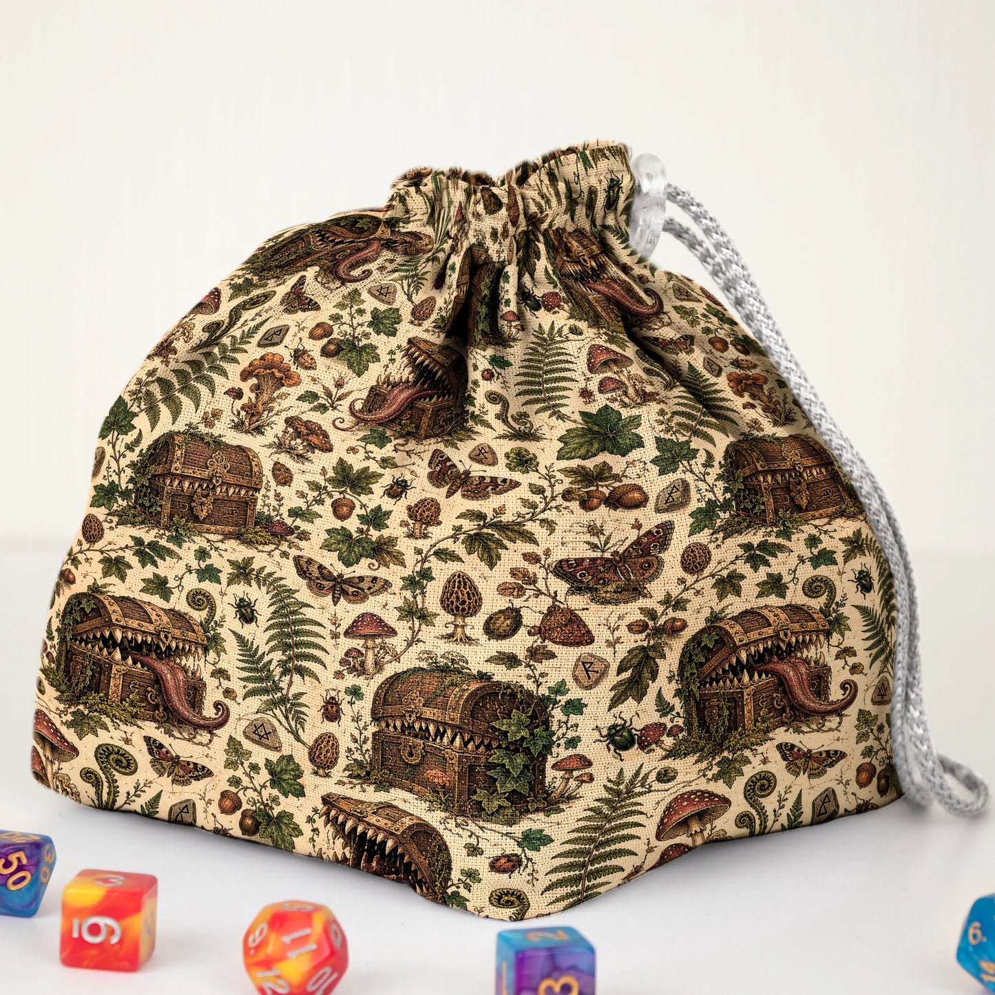 Botanical mimic dice bag print detail — treasure chests with teeth hidden among leaves