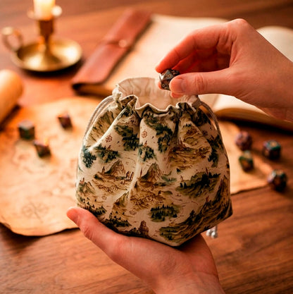 A gift for a worldbuilding dungeon master — fantasy map dice bag with pockets, mountains and forests, holds 300+ dice.