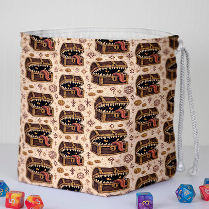 Treasure mimic dice bag print detail — mimic chests mid-ambush with spilled gold