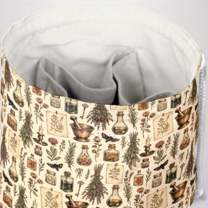 The Apothecary's Shelf dice bag front view with drawstring closure — witchy DnD pouch.