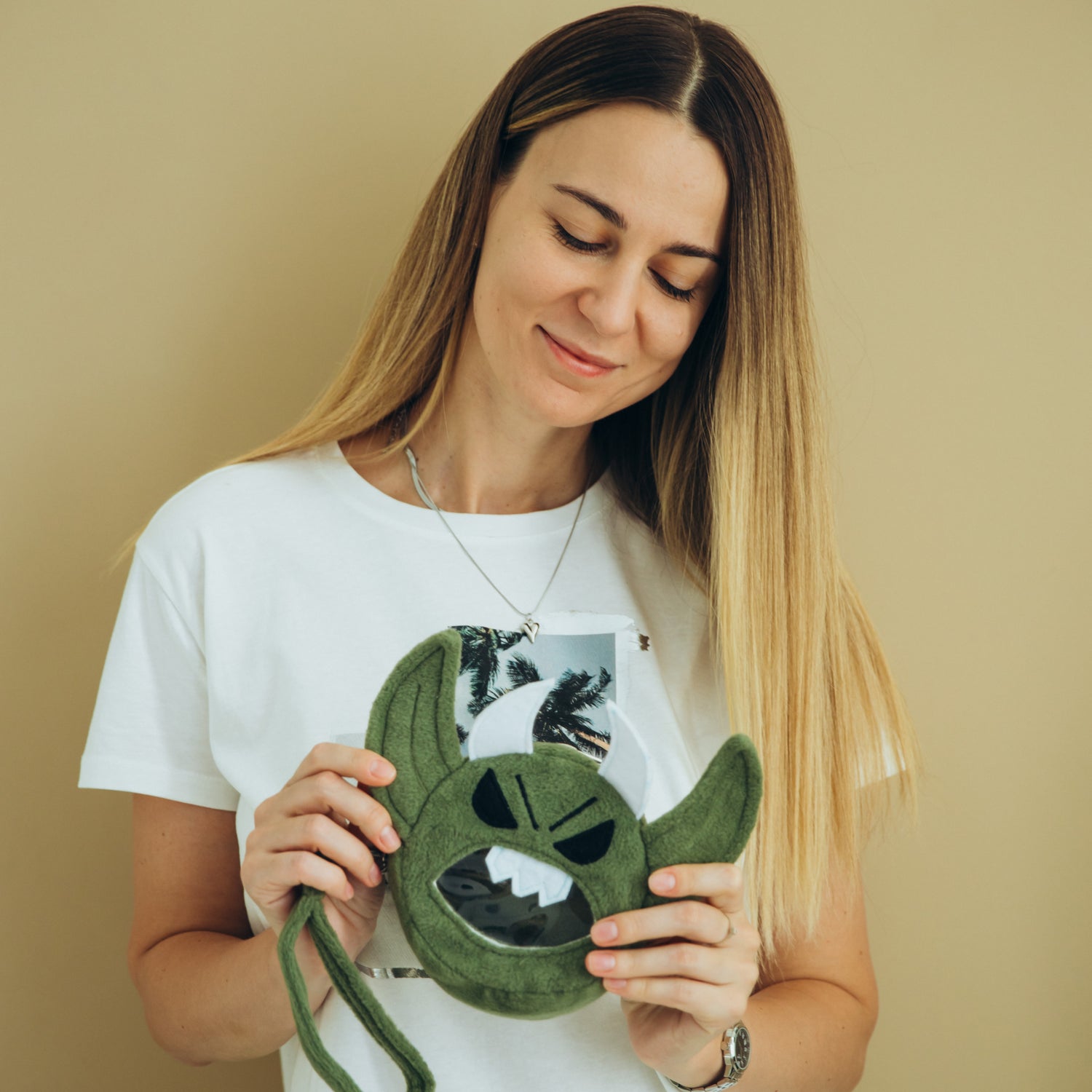 Model holding a handmade RPG accessory from GameFancy