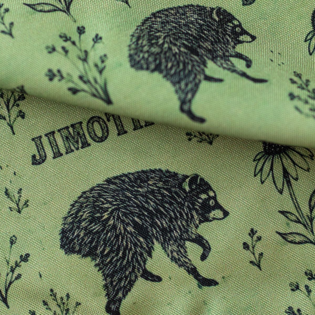 Close-up of GameFancy Jimothy raccoon print fabric, sage botanical design, used for handmade dice bags