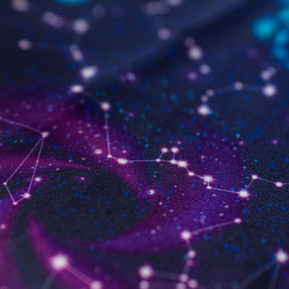 Close-up of GameFancy nebula print fabric, cosmic clouds and stars, used for handmade dice bags and trays