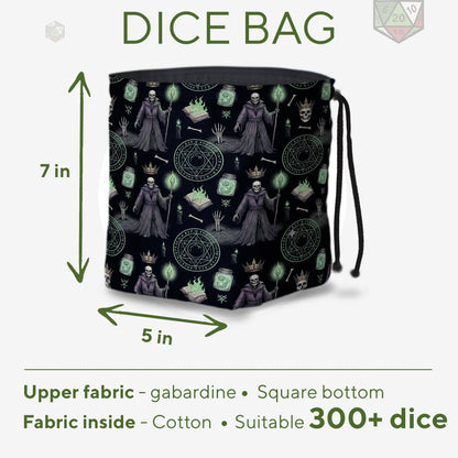 Lich necromancer dice bag held in hand — robed undead archmage print, drawstring closure