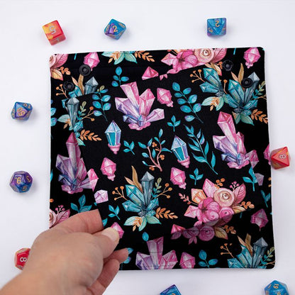 Crystal Witch dice tray folded flat, hand lifting the removable hard insert covered in the same crystal print