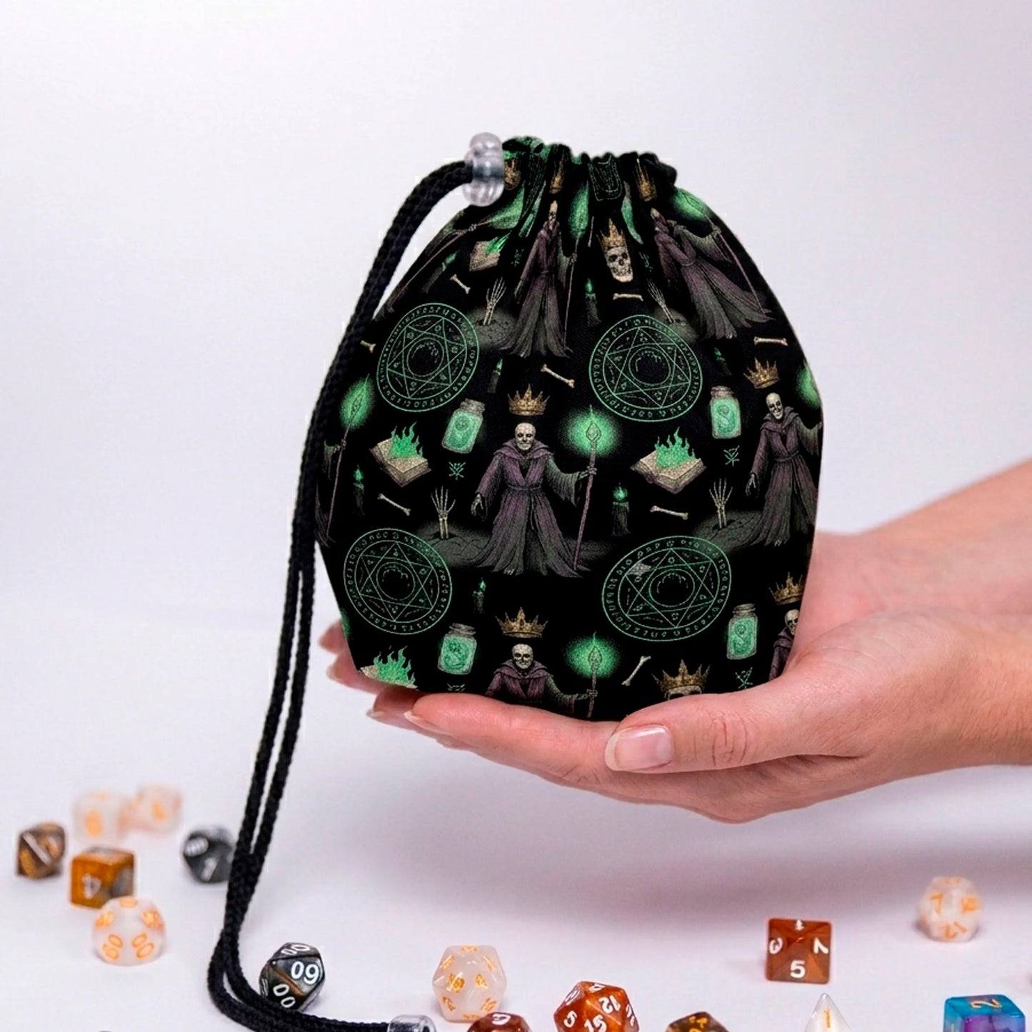 Lich dice bag — crowned skulls and green summoning circles on black gabardine, holds 300+ dice