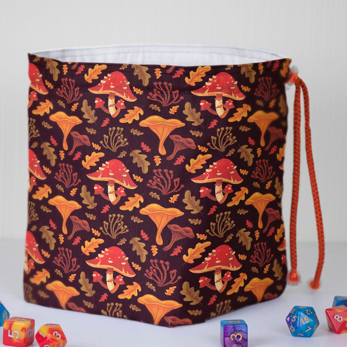 Autumn Mushroom dice bag standing upright on its square base for table-side access.