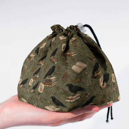 The Ravensward dice bag standing upright on its square base for table-side access.