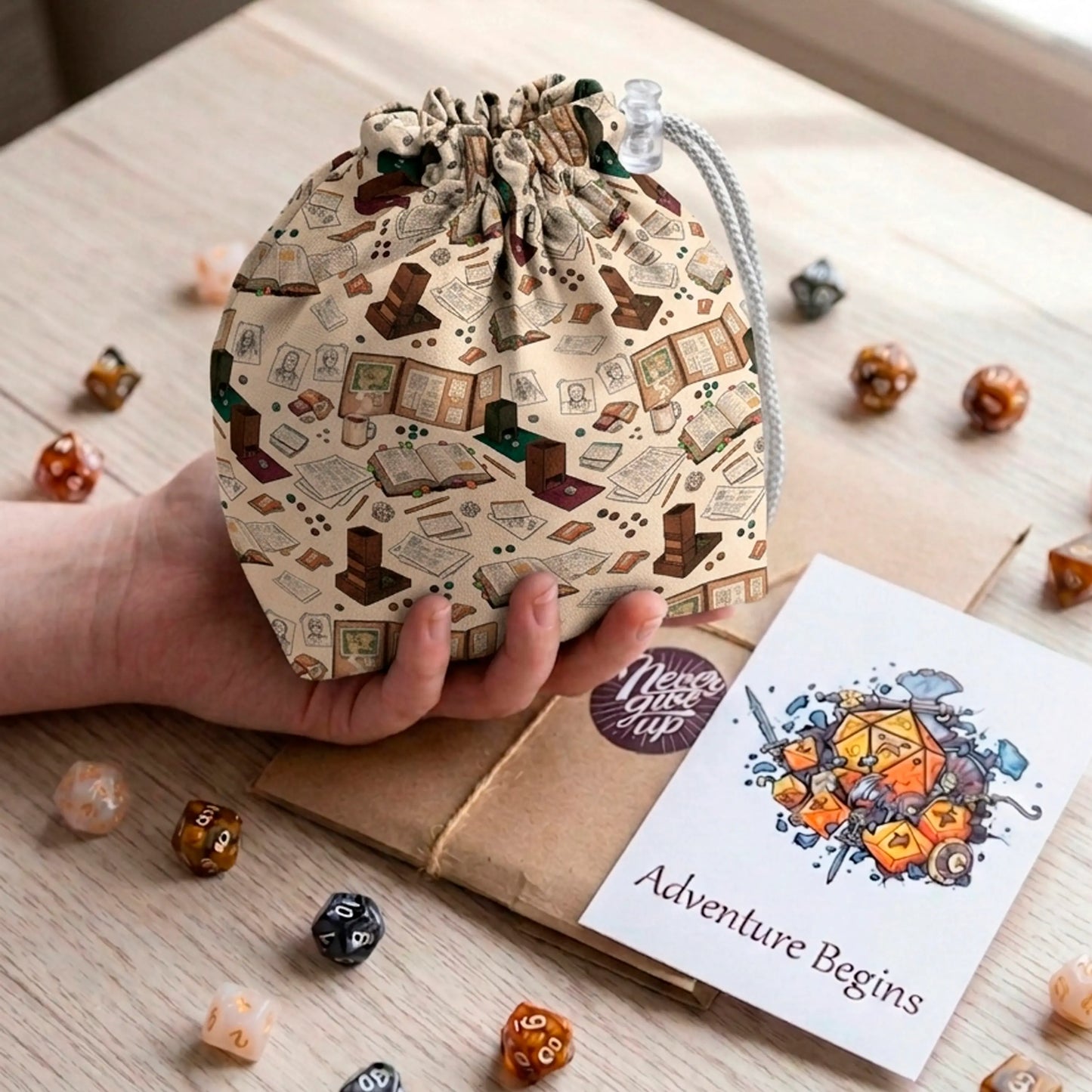 A gift for a dungeon master — behind-the-screen dice bag with rulebooks, notes and coffee on cream, holds 300+ dice.