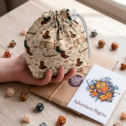 A gift for a dungeon master — behind-the-screen dice bag with rulebooks, notes and coffee on cream, holds 300+ dice.