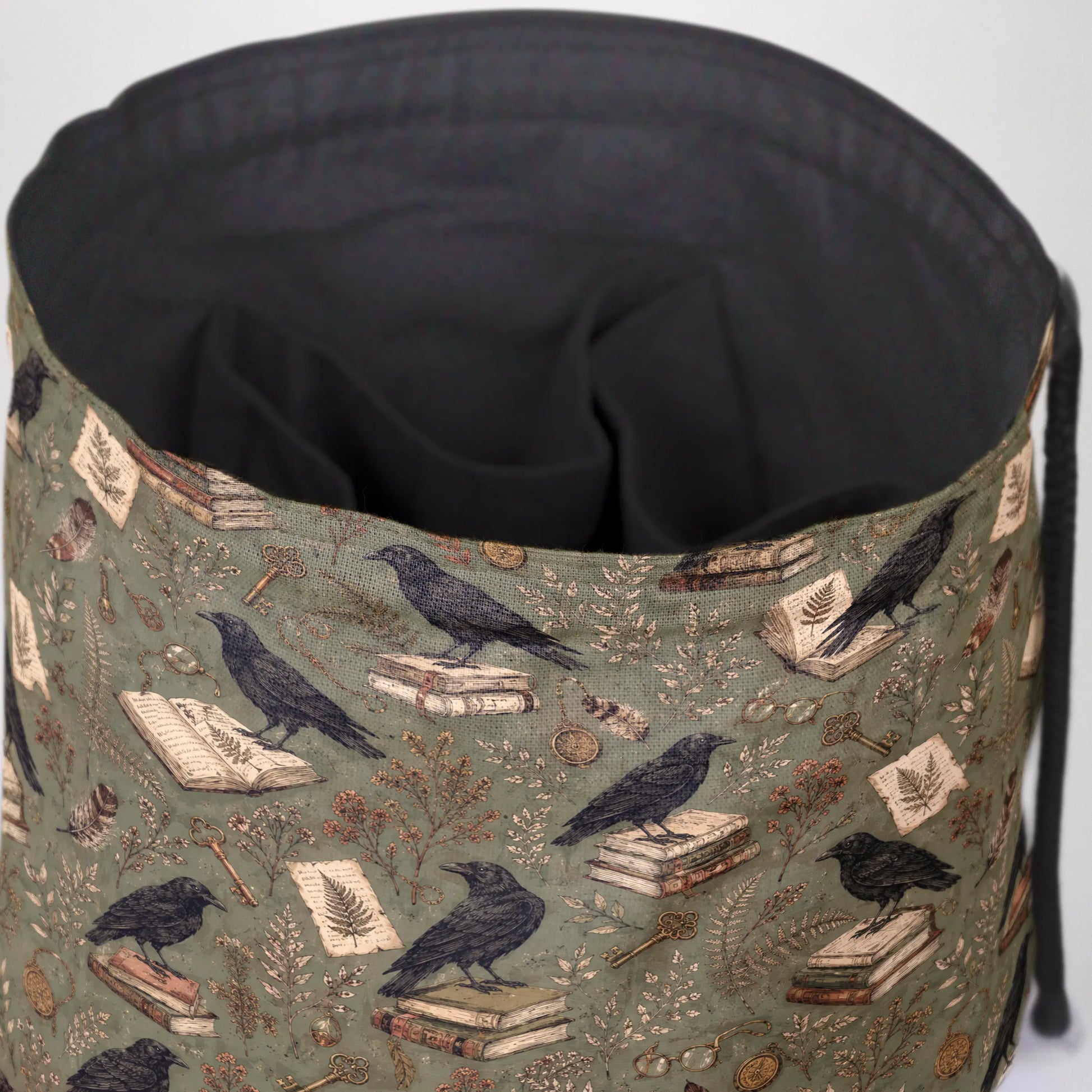 The Ravensward dice bag front view with drawstring closure — witchy dark academia DnD pouch.