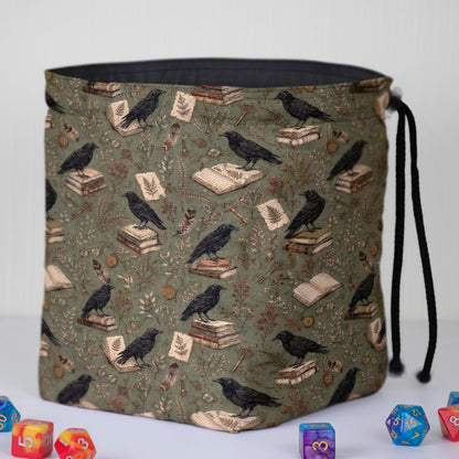 Handmade raven dice bag — corvids, keys and letters on sage, a 6-pocket dark academia organizer.