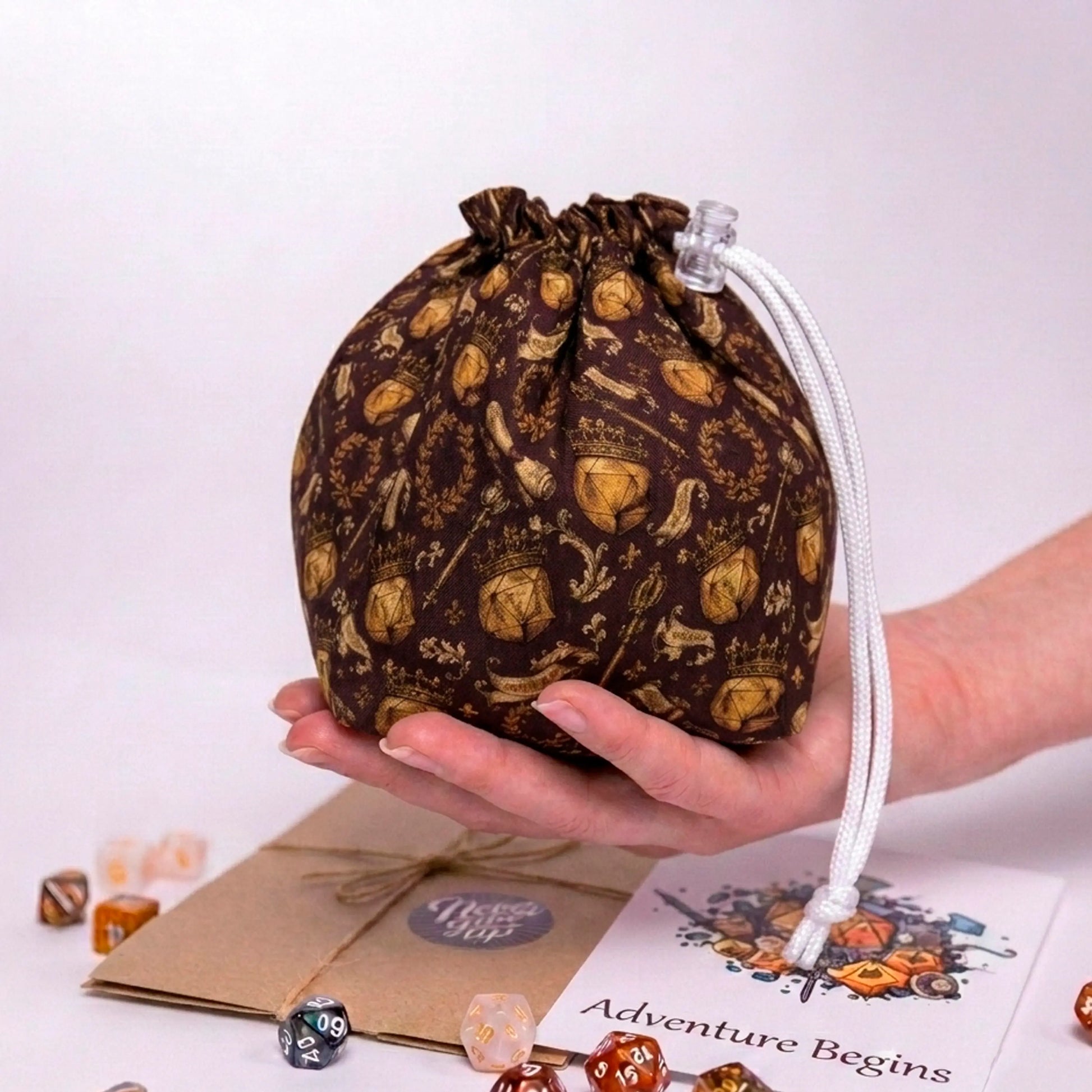 The best dungeon master gift — crowned D20 crest dice bag with pockets in warm brown, holds 300+ dice.