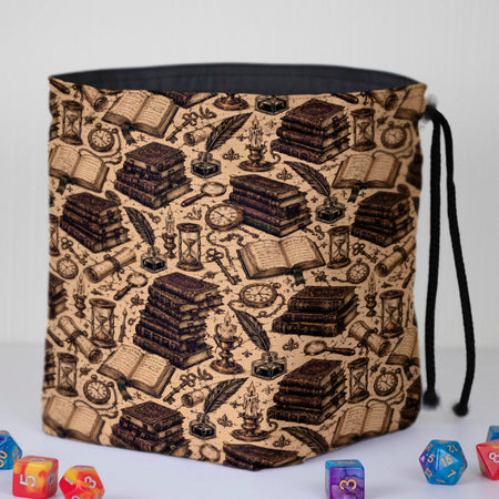 Handmade book dice bag — scrolls, quills and candles on cream, a 6-pocket dark academia organizer.