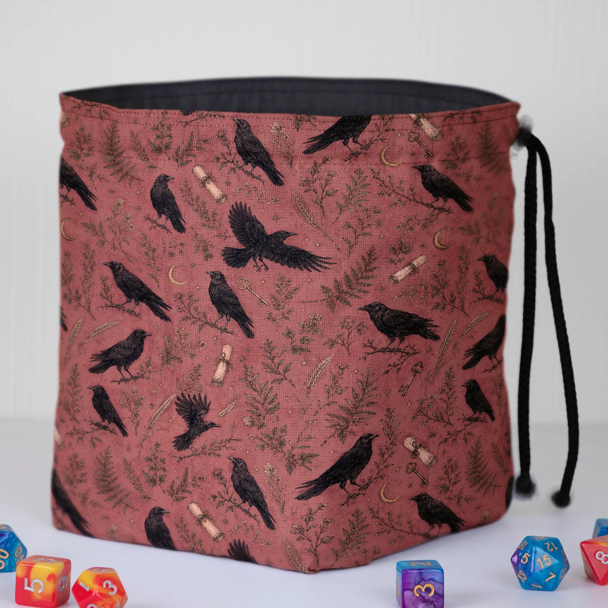 Handmade crow dice bag — corvids and ferns on rust, a 6-pocket dark academia organizer.