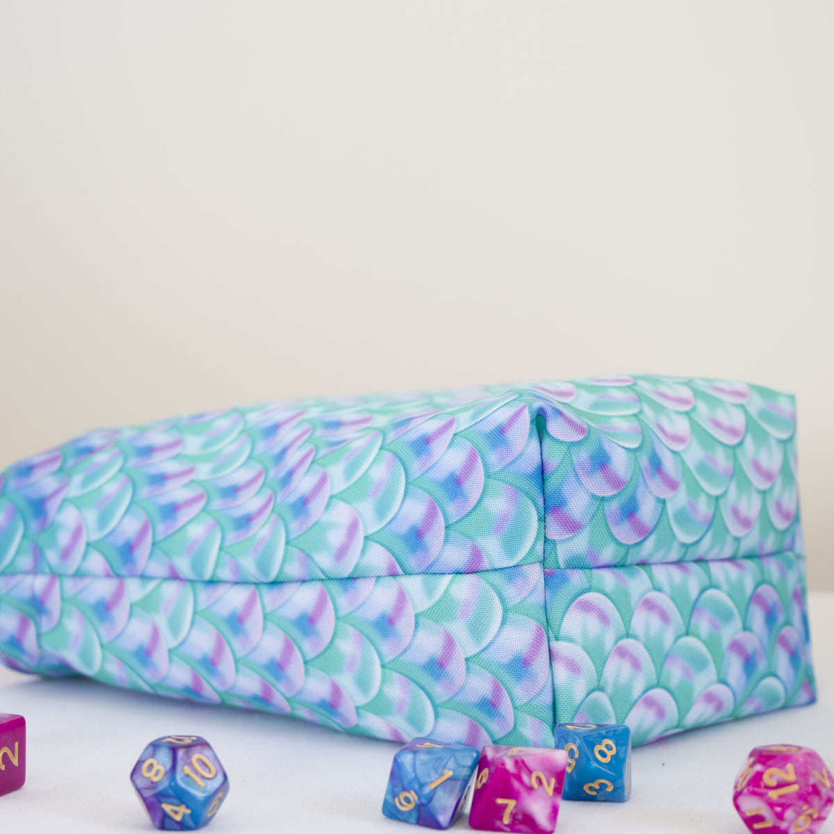 Rectangular 3 by 4 inch bottom of the small custom dice bag, mermaid scale print fabric