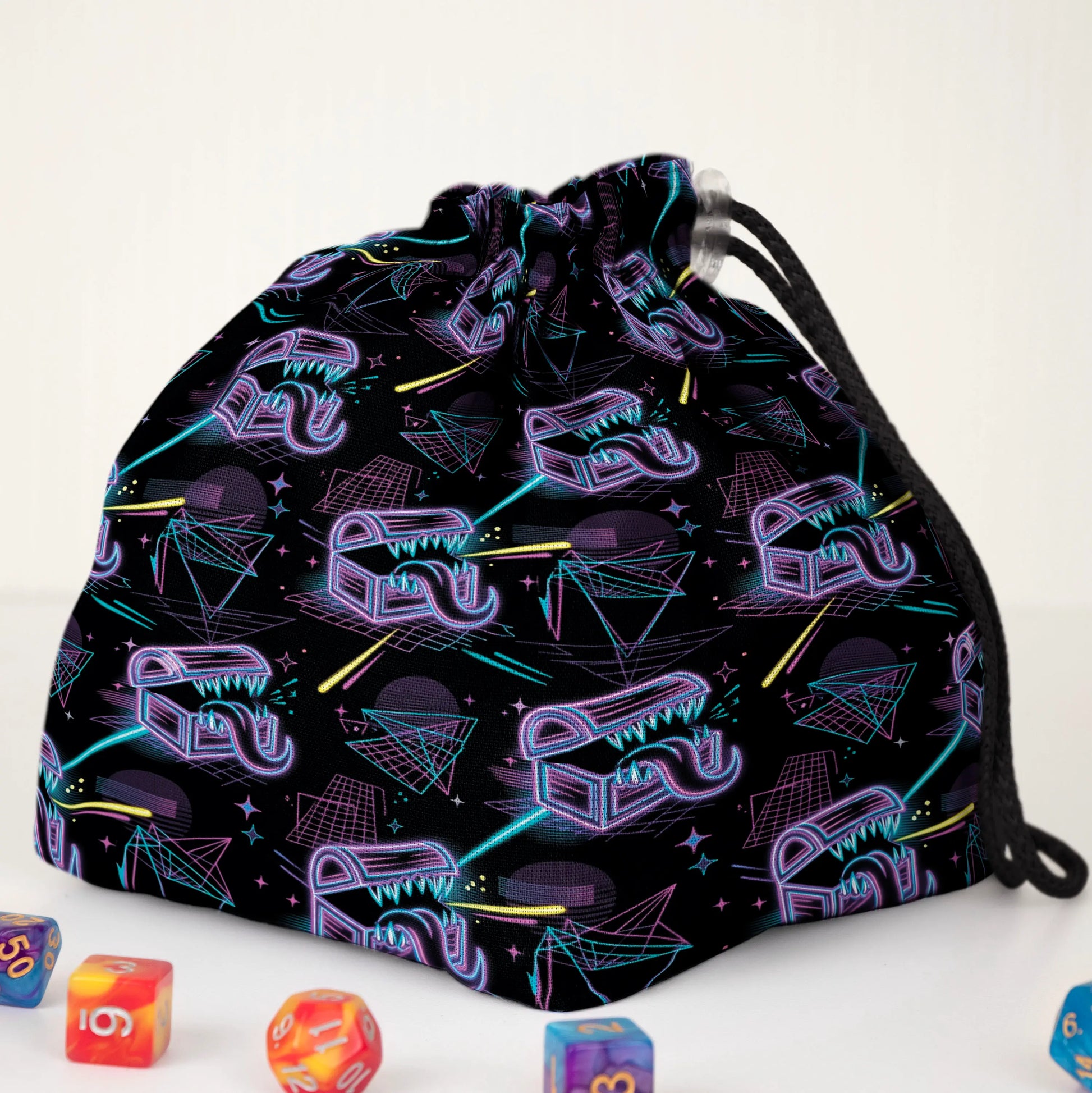 Synthwave mimic dice bag print detail — neon treasure chests and laser grid on black