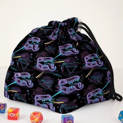 Synthwave mimic dice bag print detail — neon treasure chests and laser grid on black