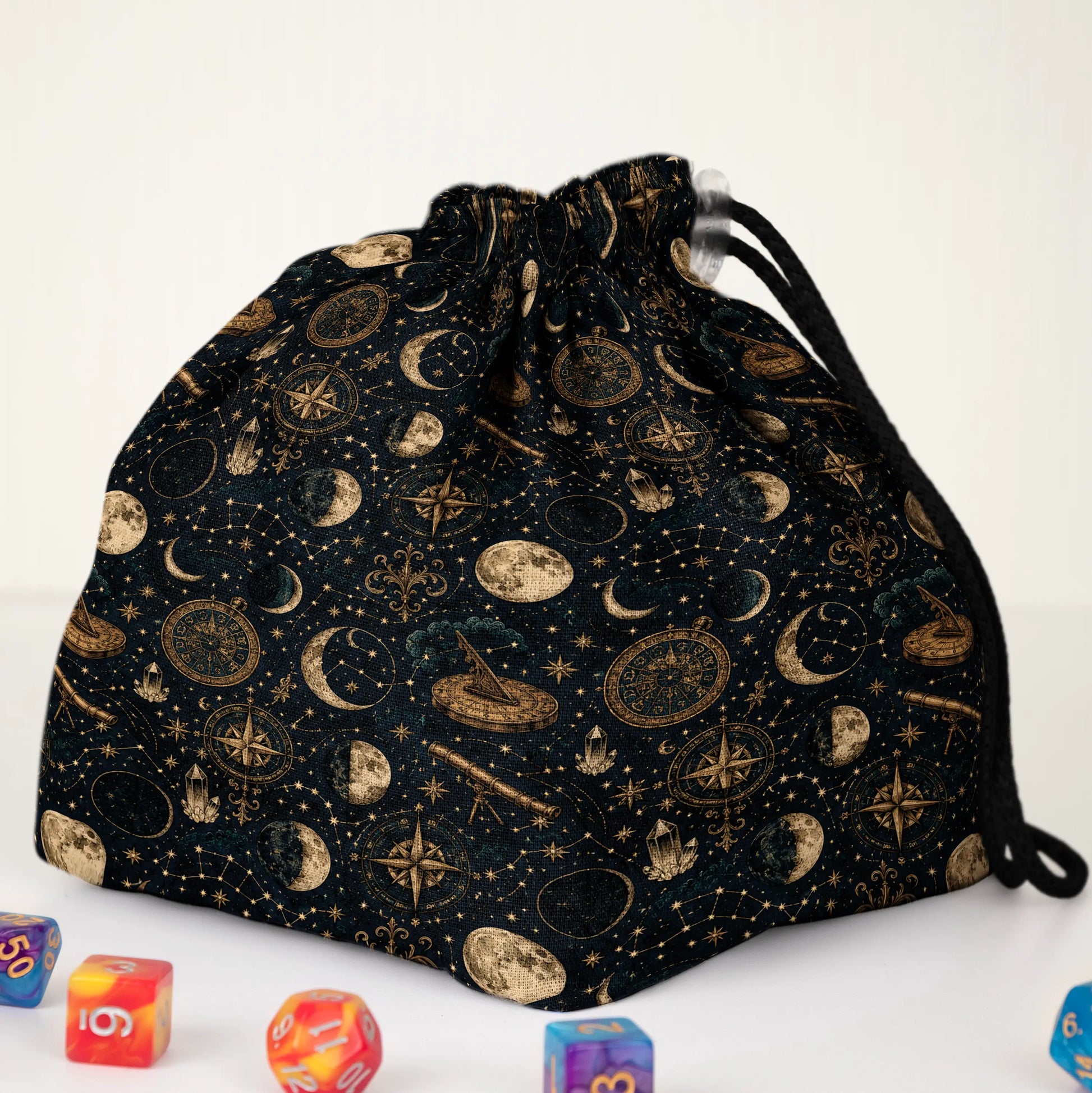 Close-up of the Celestial Almanac print — gold moon phases, compasses and stars on midnight-navy gabardine.