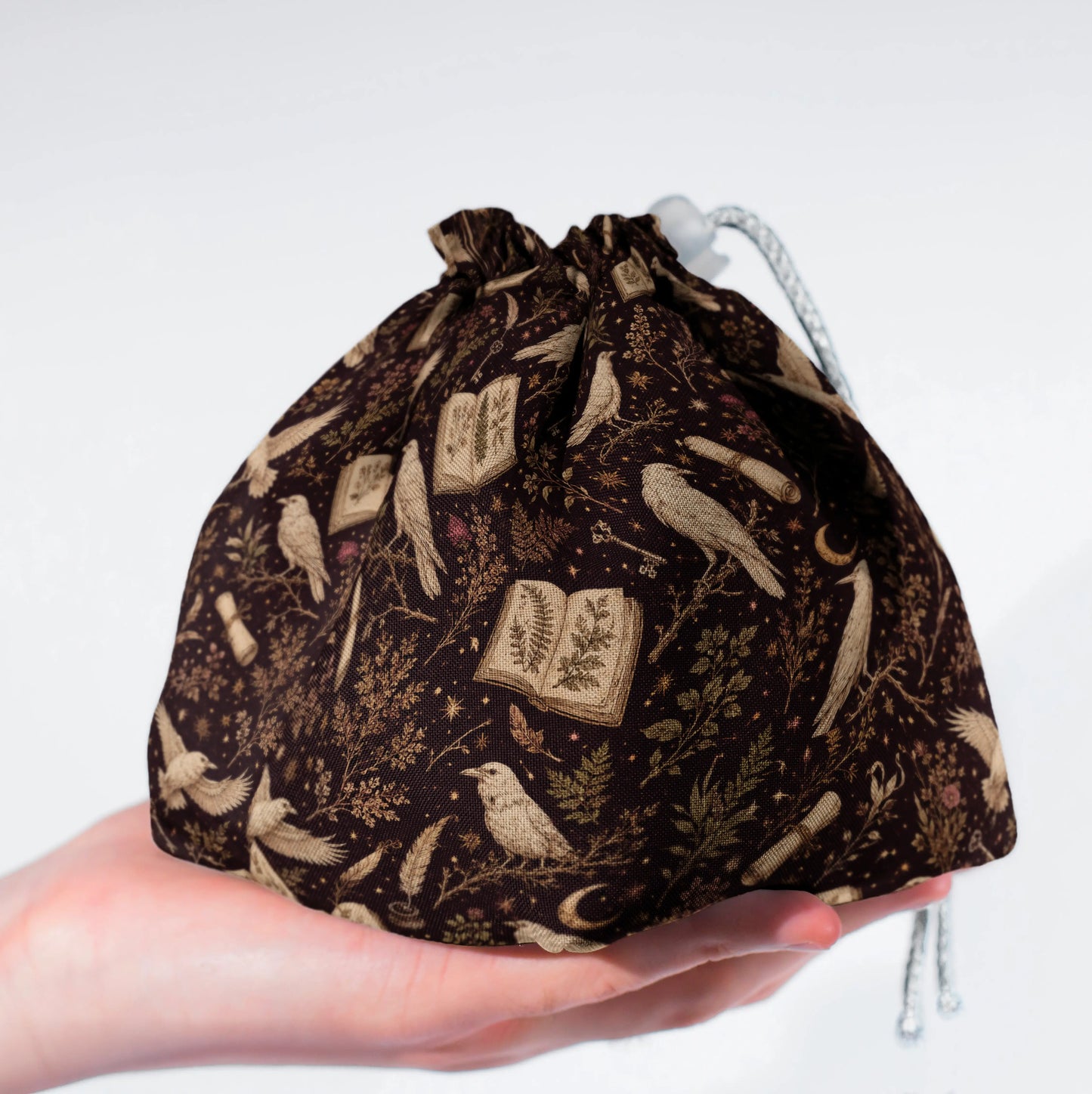Raven's Codex dice bag standing upright on its square base for table-side access.