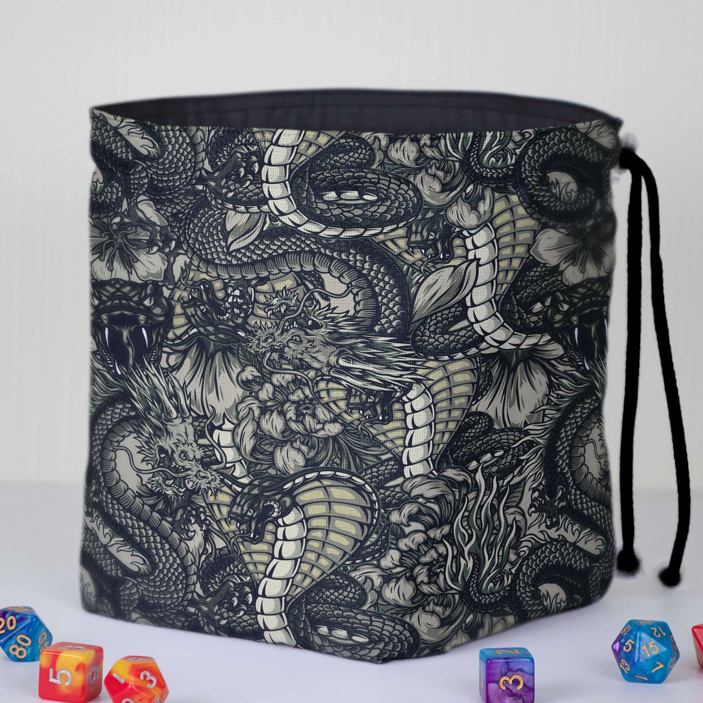 Black-and-white dragon line-art dice bag — detailed monochrome fantasy print on gabardine.