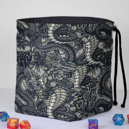 Black-and-white dragon line-art dice bag — detailed monochrome fantasy print on gabardine.