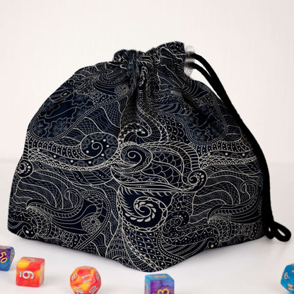 Dragon scale dice bag with rainbow pockets for sorting dice by set.