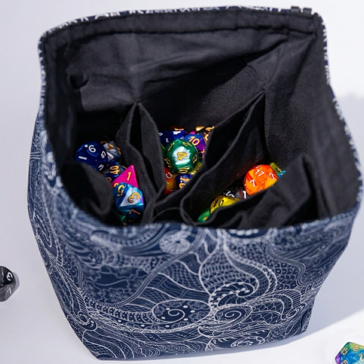 Best gift for a DnD player — dragon scale dice bag with pockets for a Dungeon Master, holds 300+ dice.