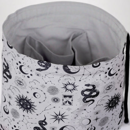 Celestial serpent dice bag with 6 pockets — sorts dice sets for a witchy table.