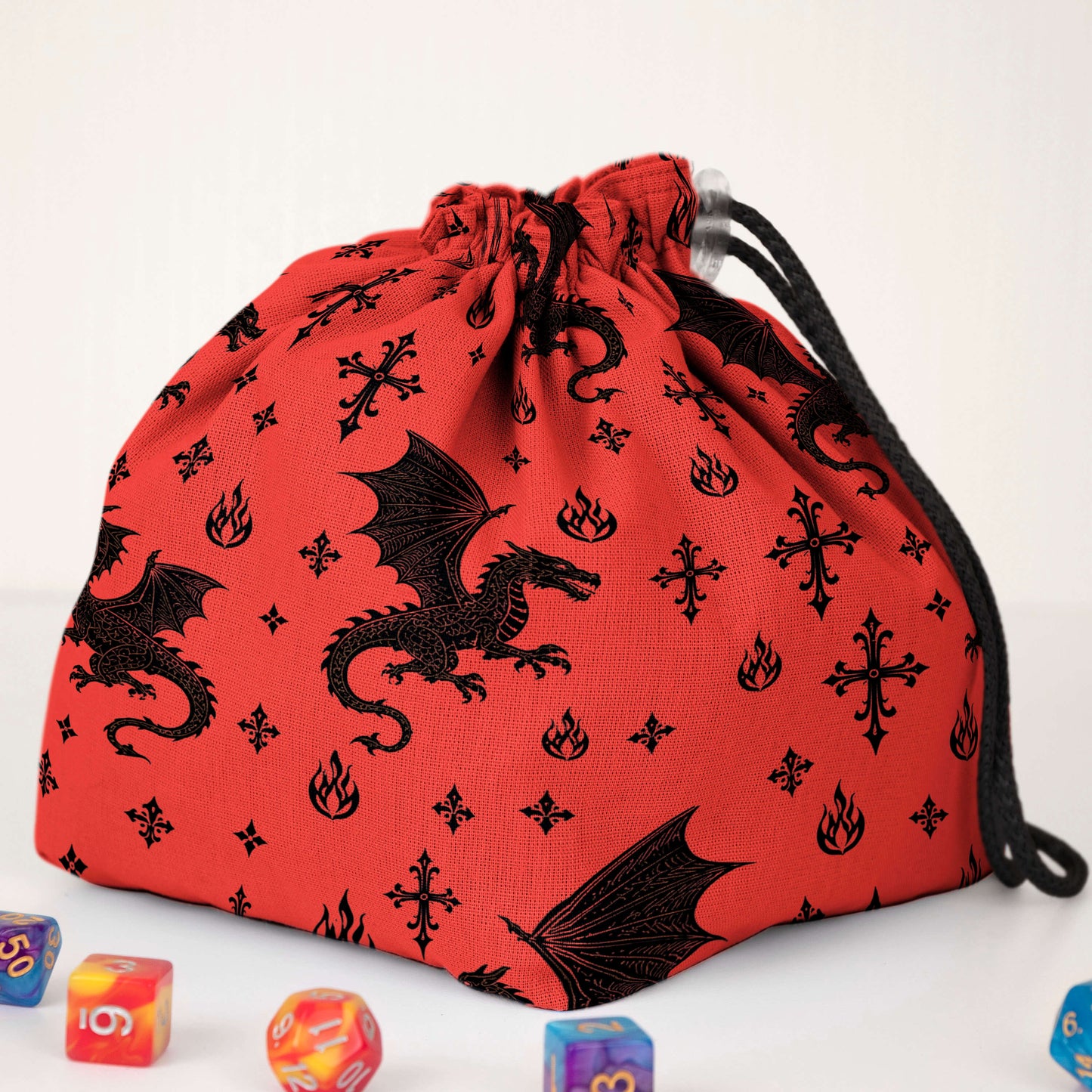 Handmade red dragon dice bag — black dragons, gothic crosses, and flames on red gabardine, holds 300+ dice.