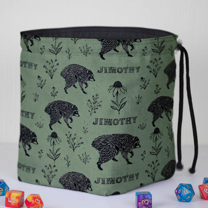 Sage botanical Jimothy dice bag standing open on its square base, dark cotton lining visible, with DnD dice
