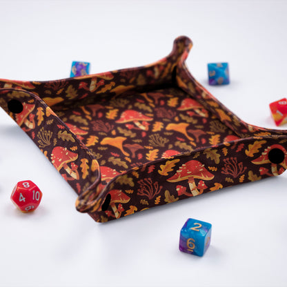 Autumn mushroom dice tray — red caps and chanterelles on brown, snap-button collapsible tray.