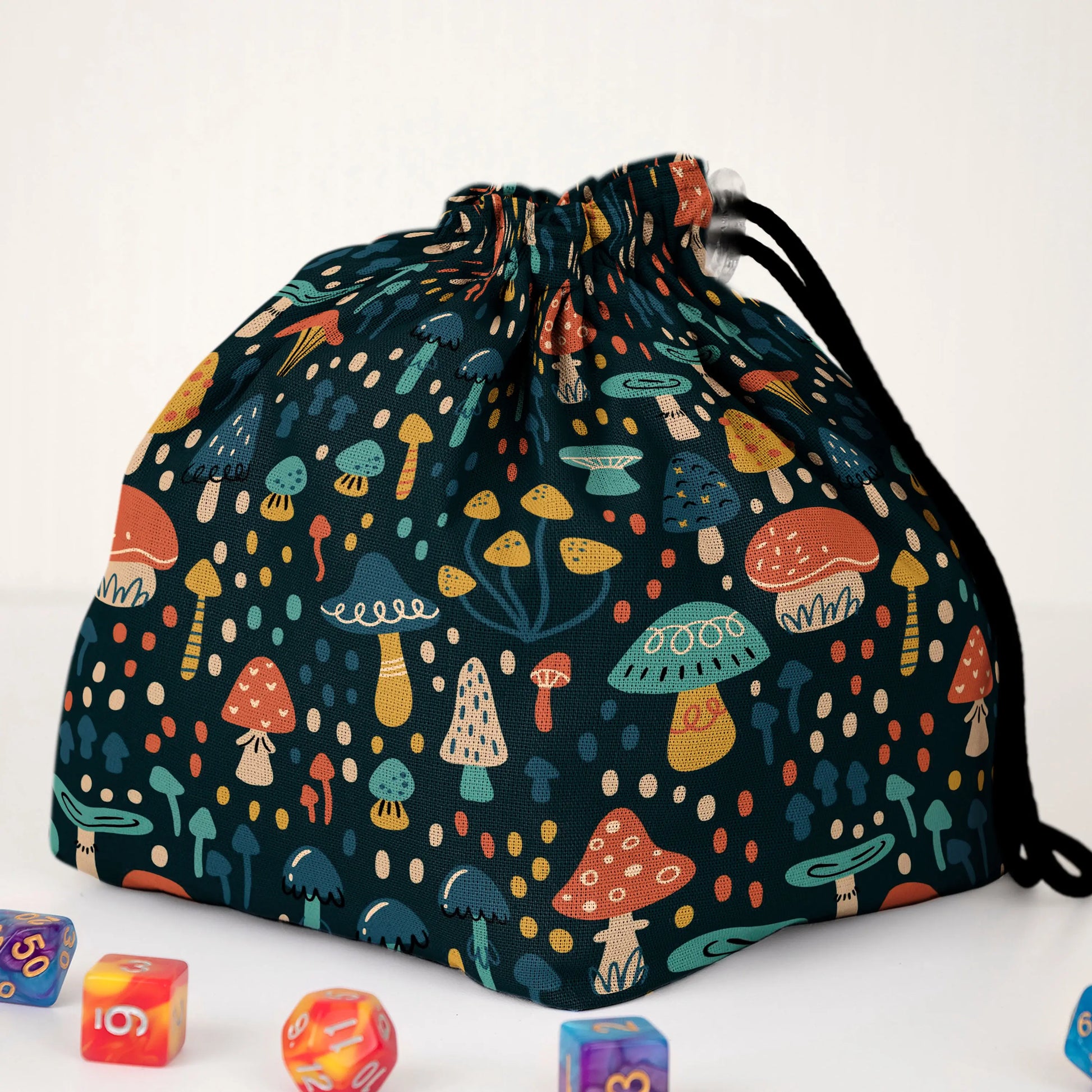 Close-up of the whimsical mushroom print — colourful folk toadstools on teal gabardine.