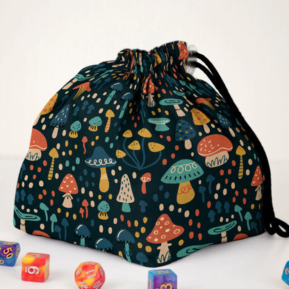Close-up of the whimsical mushroom print — colourful folk toadstools on teal gabardine.