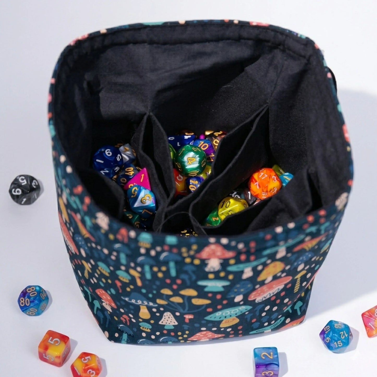 Handmade mushroom dice bag — folk-art toadstools on teal, a 6-pocket cottagecore organizer.