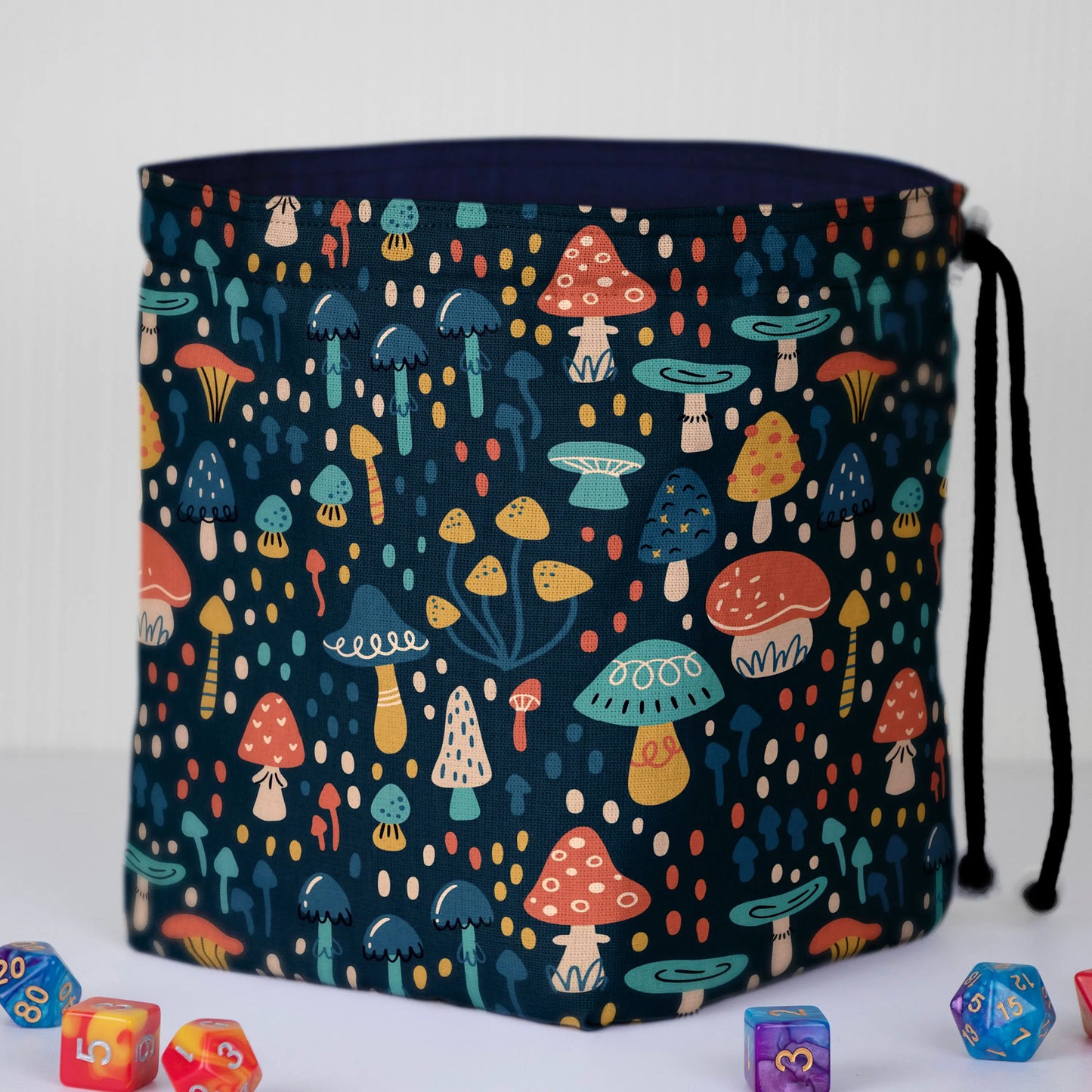 Whimsical Mushroom dice bag standing upright on its square base for table-side access.