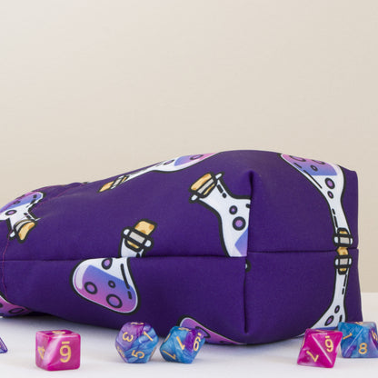Bottom view of the purple potion print custom dice bag, rectangular base holds its shape
