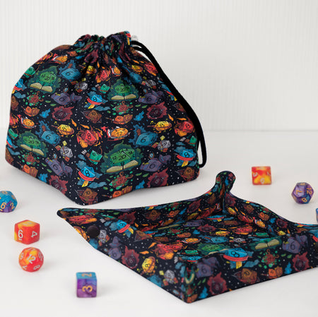 Dungeon Master gift set — rainbow spellbook dice bag with a matching fold-flat tray, holds 300+ dice.