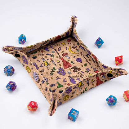 Witchy peach dice tray at an angle, hand-drawn spellcraft doodles on the sides