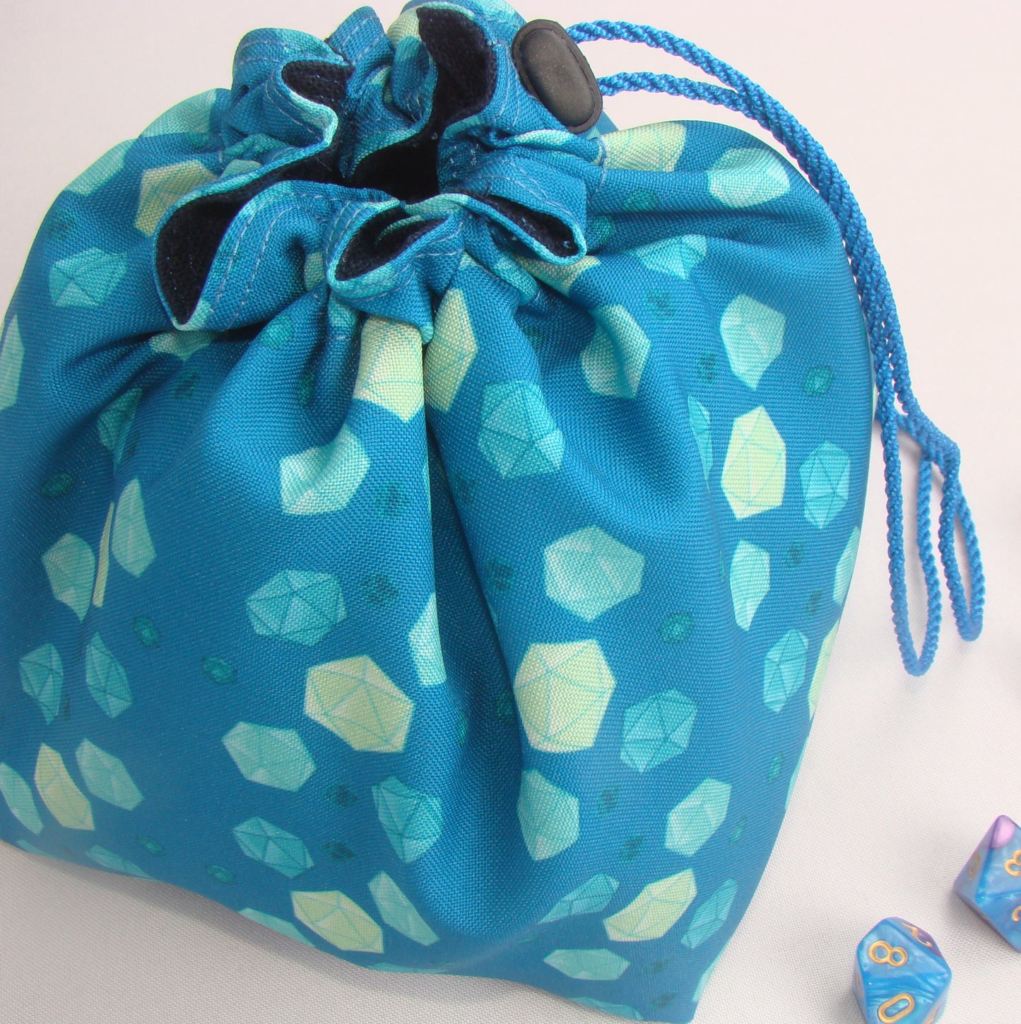 Mint dice bag standing open — large handmade DnD dice bag with pockets.