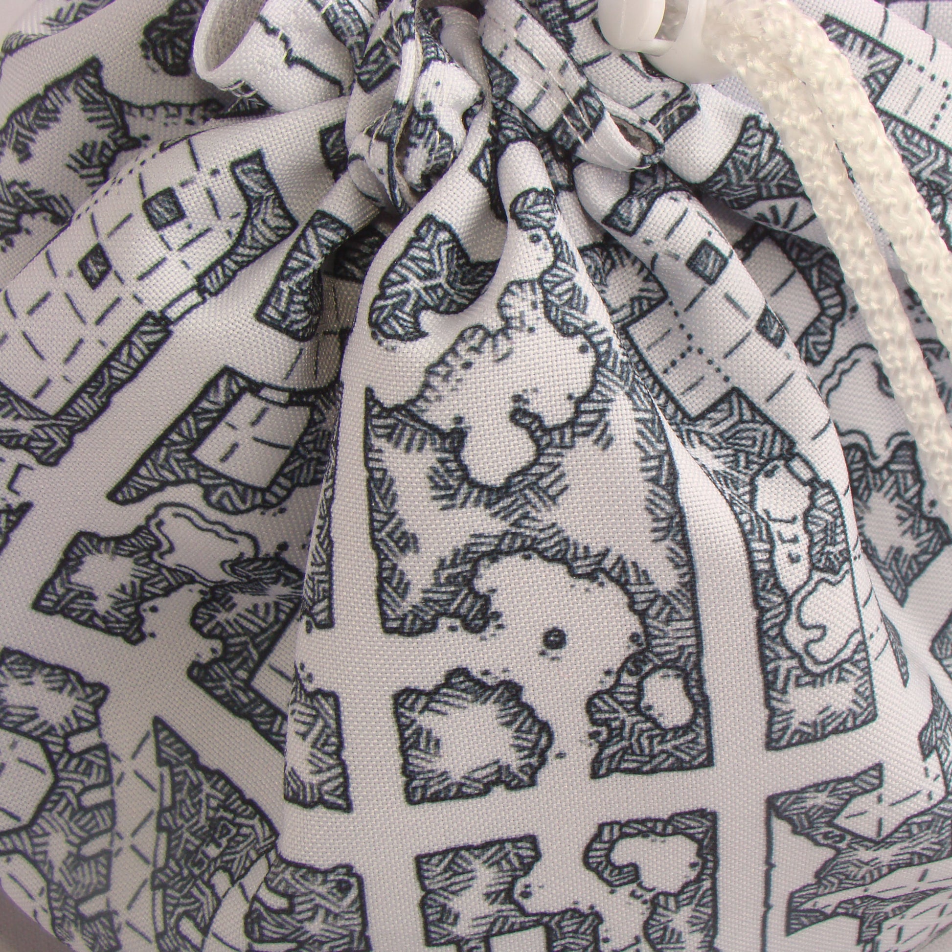 Black and white dungeon map dice bag standing open — large handmade DnD organizer.